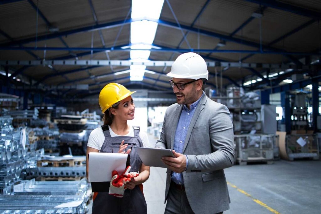 manager supervisor worker discussing about production results new strategy factory industrial hall (1)