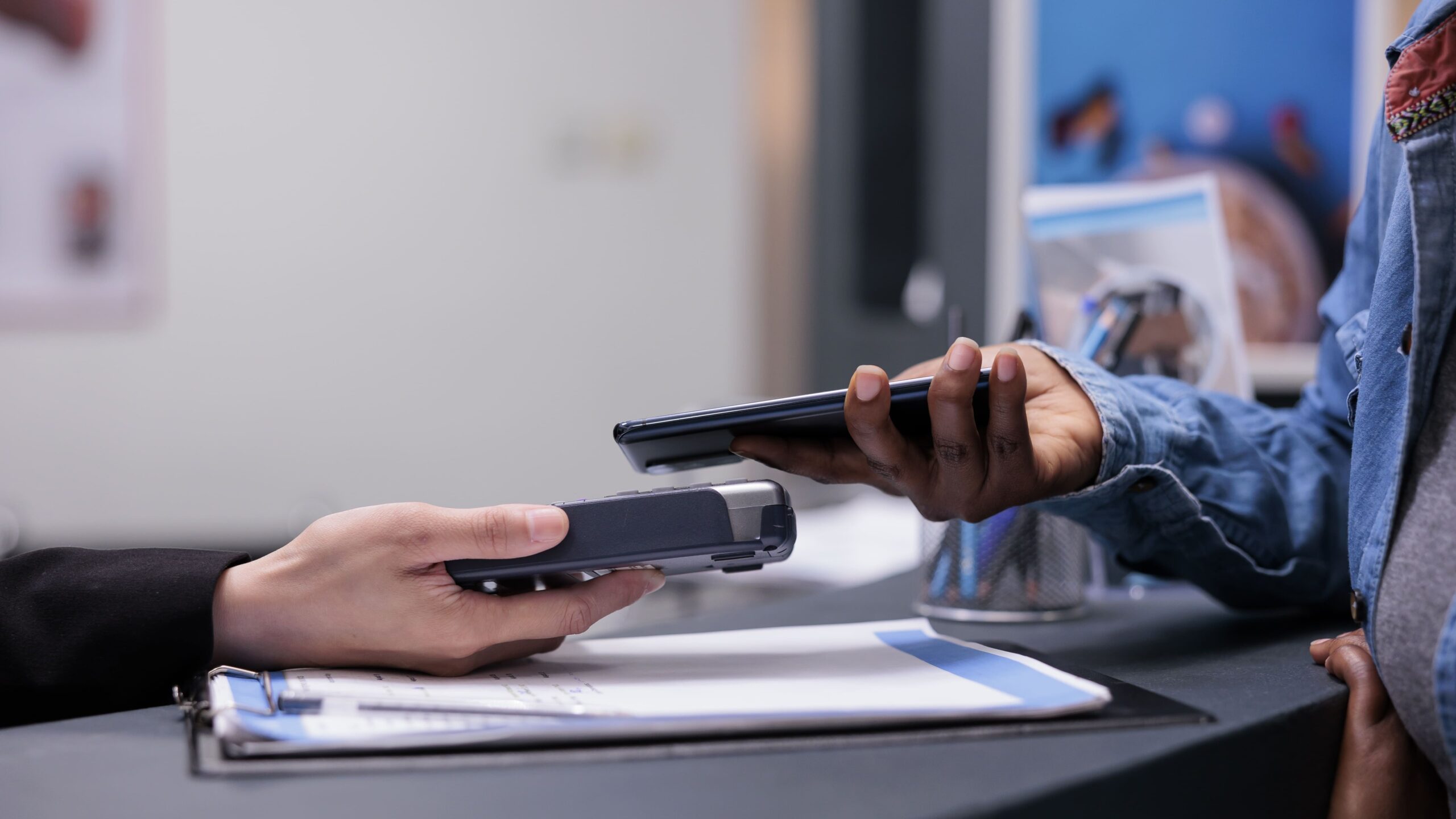 patient using credit card pay checkup visit with specialist paying consultation treatment facility reception desk making payment after having examination appointment close up
