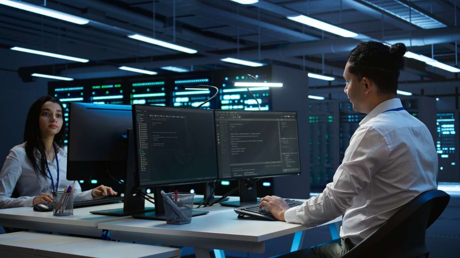 portrait cheerful engineer data center installing software computer (1)
