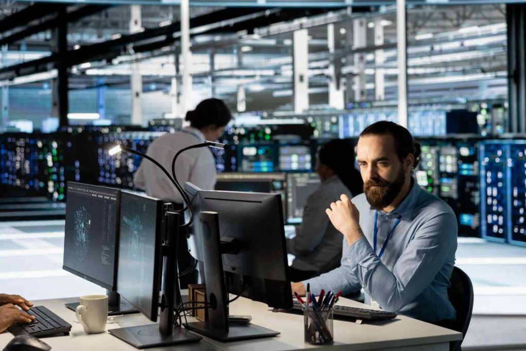 technician using pc data center update server tech configuring equipment (1)